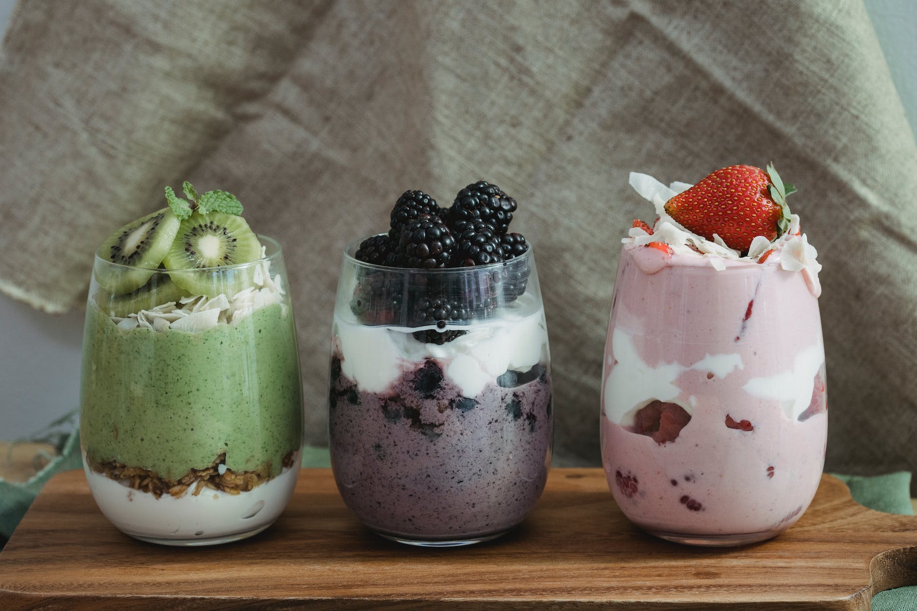 decorative, fresh fruits with yogurt in clear glass