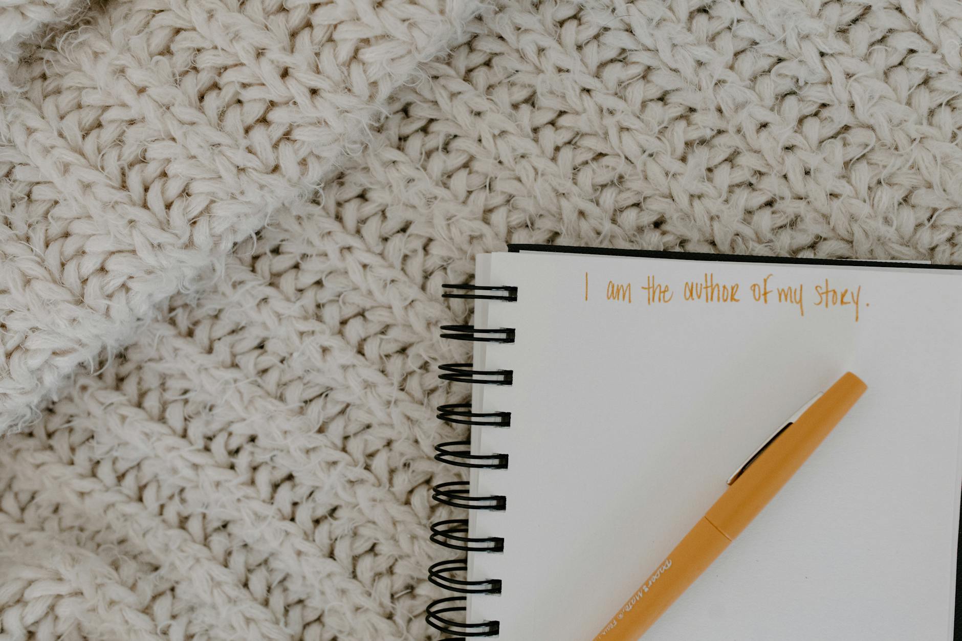 close up shot of a pen on a notebook