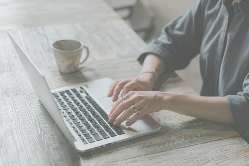 woman typing on laptop