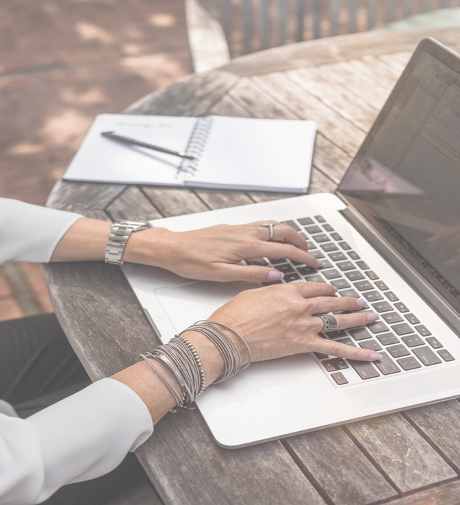 woman typing on laptop